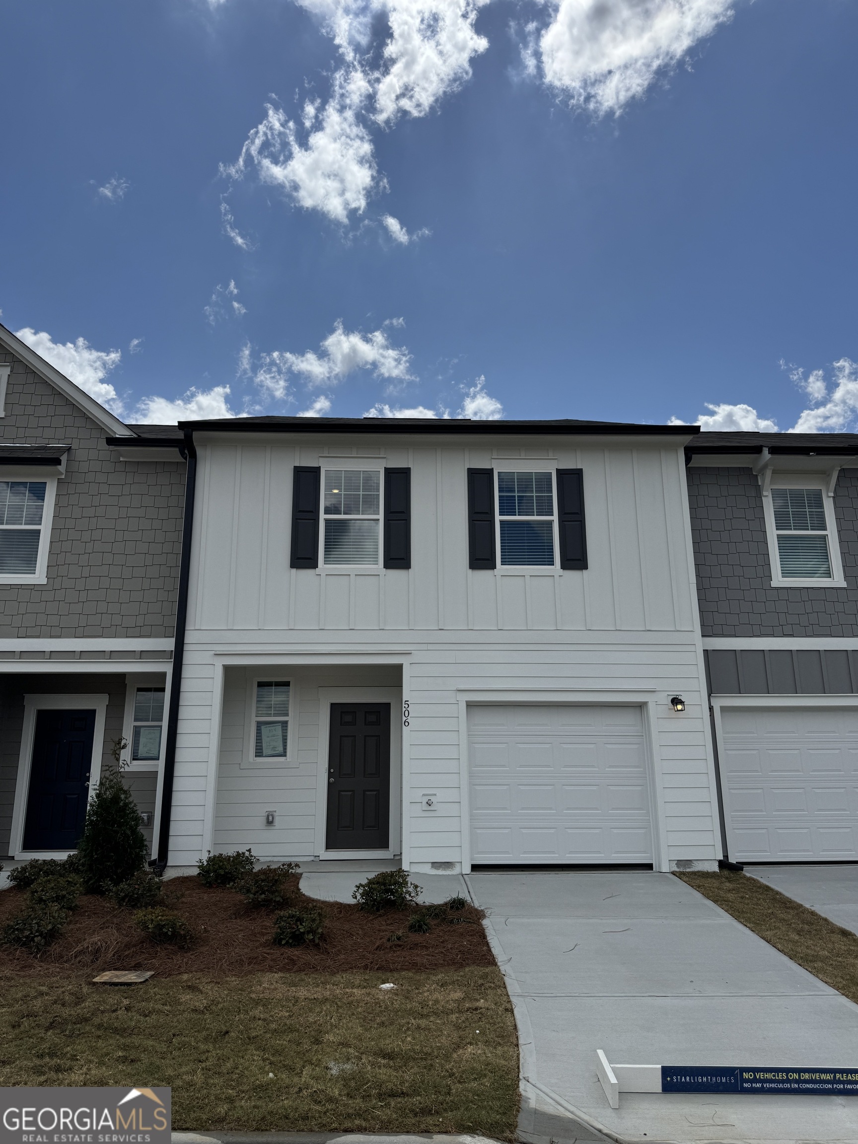 506 Robson Drive, Unit 224 Villa Rica, GA 30180 - Photo 1 of 1 a front view of a house with a yard