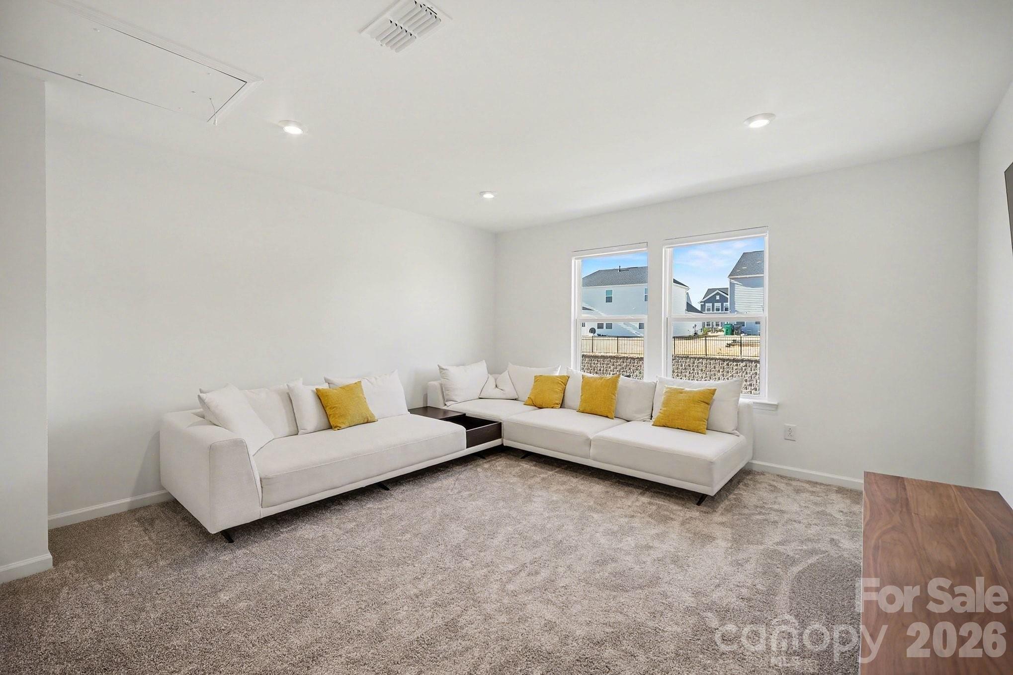 11122 Glasden Road Charlotte, NC 28278 - Photo 17 of 32 a living room with furniture and a couch