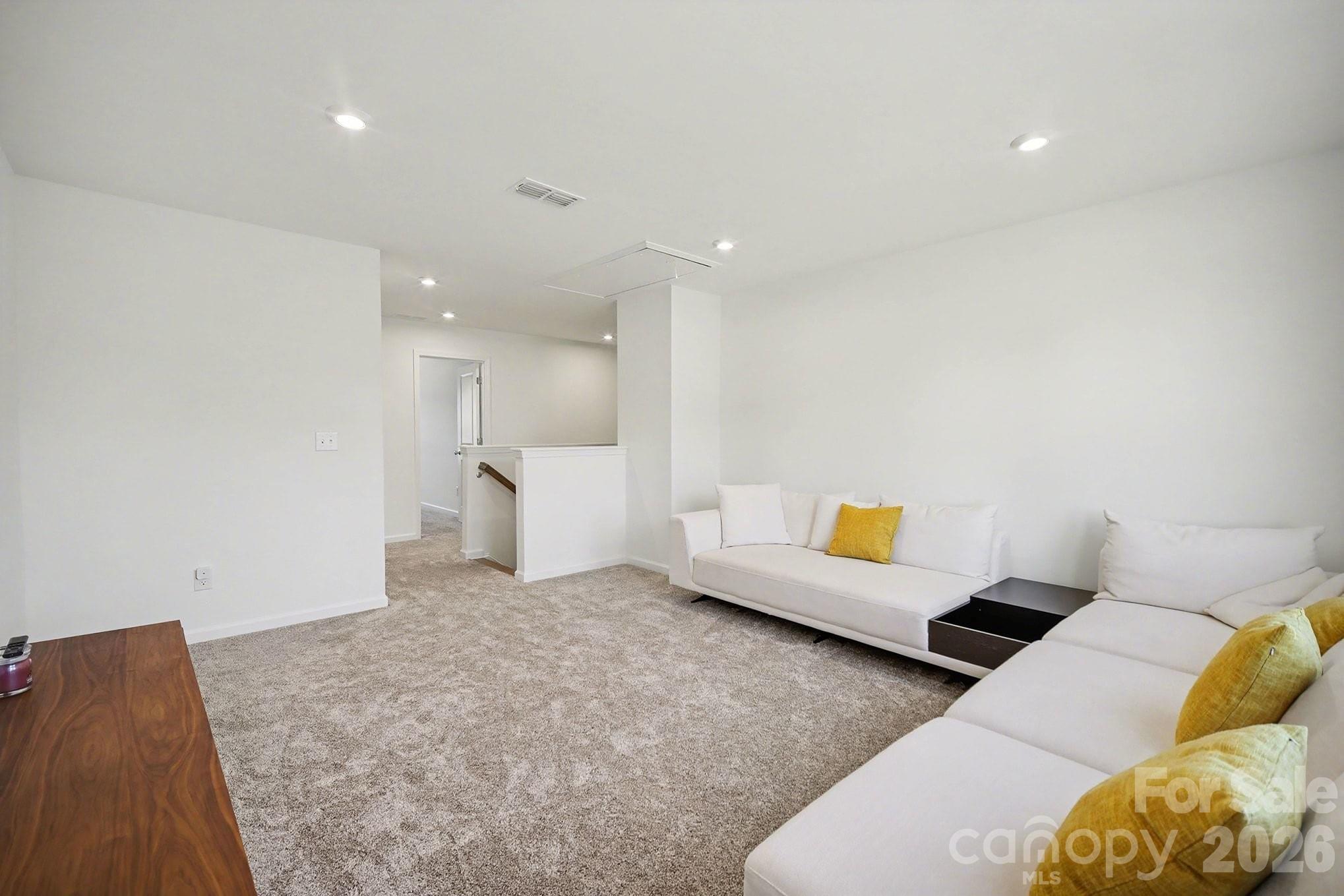 11122 Glasden Road Charlotte, NC 28278 - Photo 18 of 32 a living room with furniture and white walls