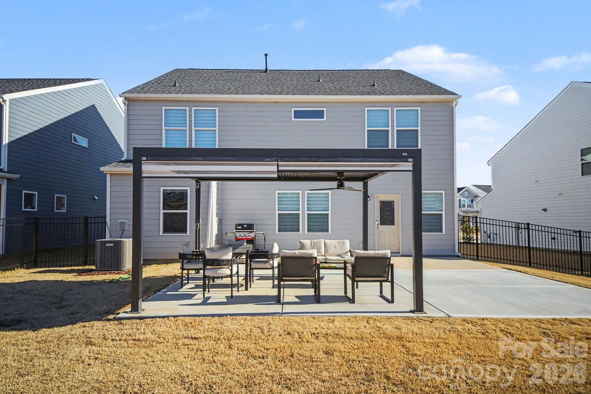11122 Glasden Road Charlotte, NC 28278 - Photo 31 of 32 a view of a house with backyard porch and patio