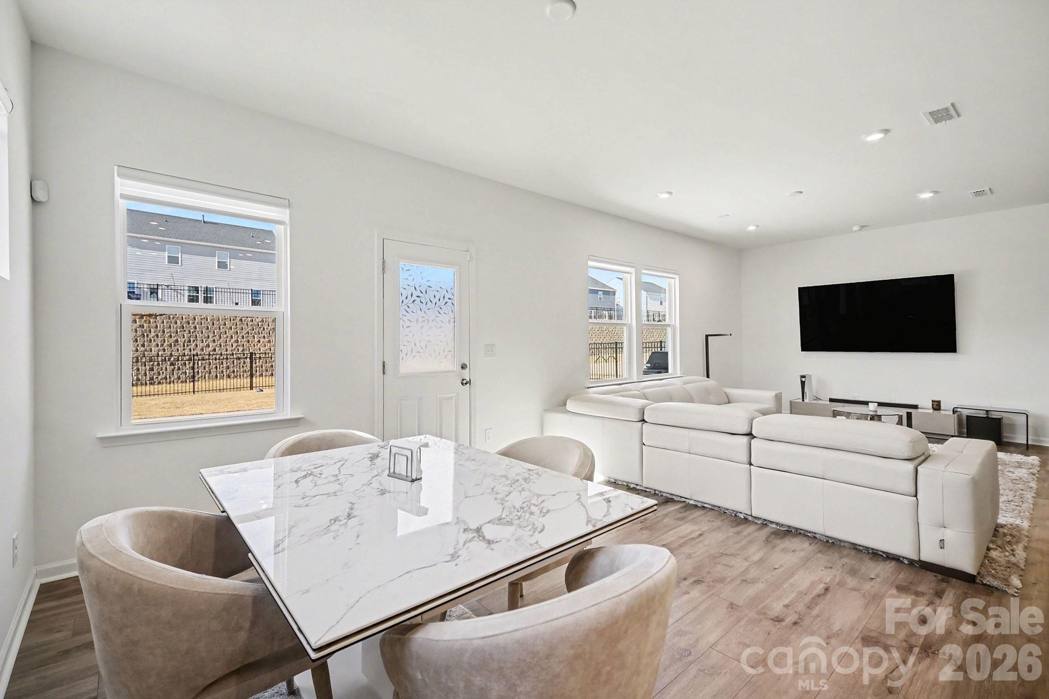 11122 Glasden Road Charlotte, NC 28278 - Photo 4 of 32 a living room with furniture and a flat screen tv