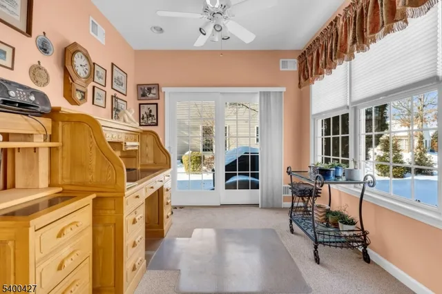 a living room with patio furniture