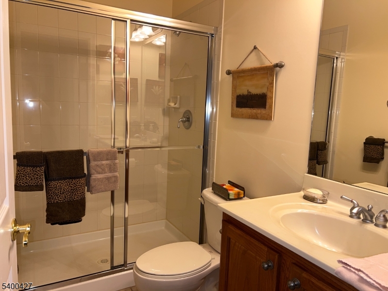 18 Bayard Road Somerset, NJ 08873 - Photo 13 of 15 a bathroom with a sink a toilet and shower