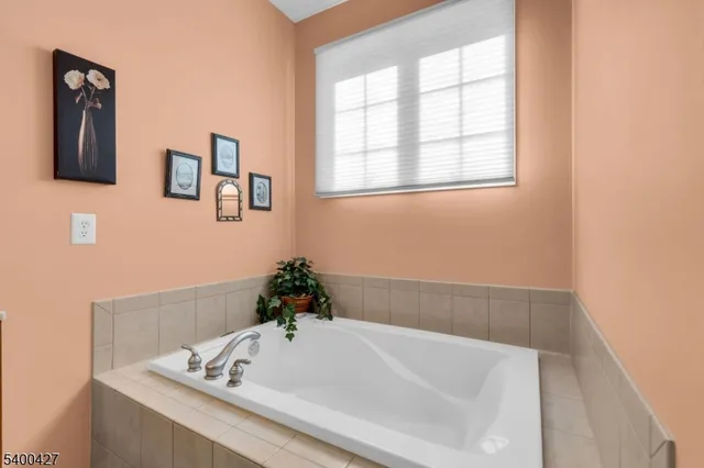a bathroom with a bathtub and a sink