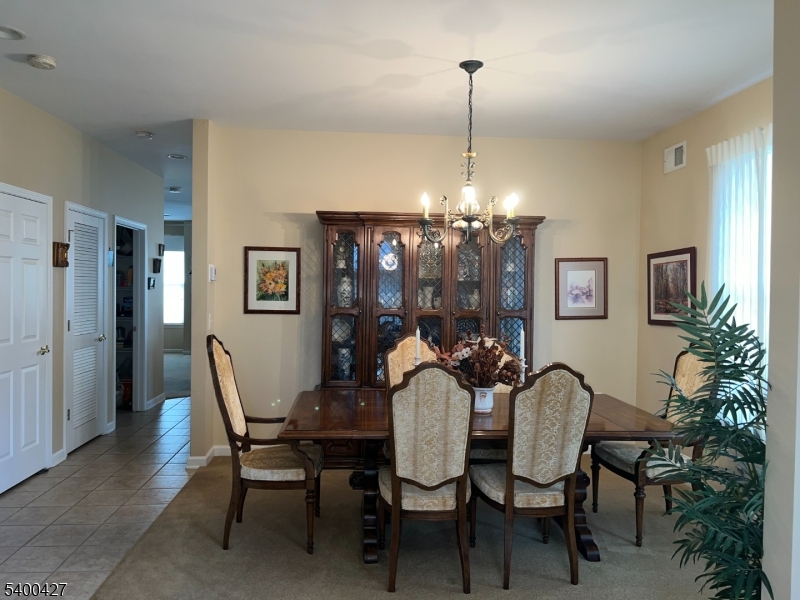 18 Bayard Road Somerset, NJ 08873 - Photo 4 of 15 a view of a dining room with furniture and chandelier