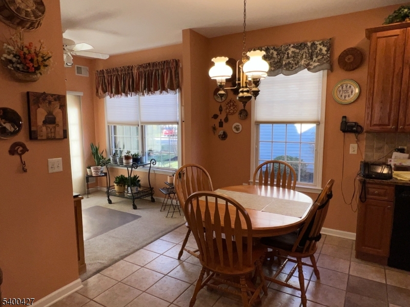 18 Bayard Road Somerset, NJ 08873 - Photo 7 of 15 a view of a dining room and livingroom with furniture window and wooden floor