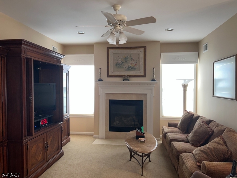 18 Bayard Road Somerset, NJ 08873 - Photo 8 of 15 a living room with furniture and a fireplace