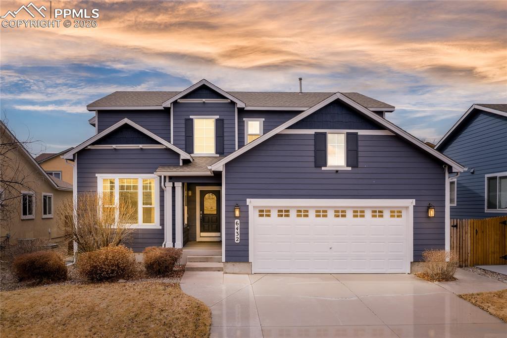 6432 Crystal Mountain Road Colorado Springs, CO 80923 - Photo 1 of 31 a front view of a house with garage