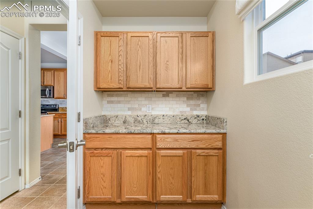 6432 Crystal Mountain Road Colorado Springs, CO 80923 - Photo 12 of 31 a view of cabinets with wooden floor