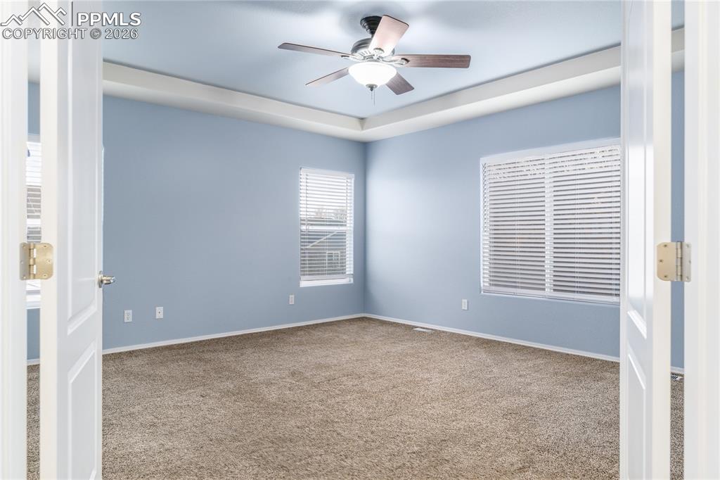 6432 Crystal Mountain Road Colorado Springs, CO 80923 - Photo 15 of 31 a view of an empty room with a window