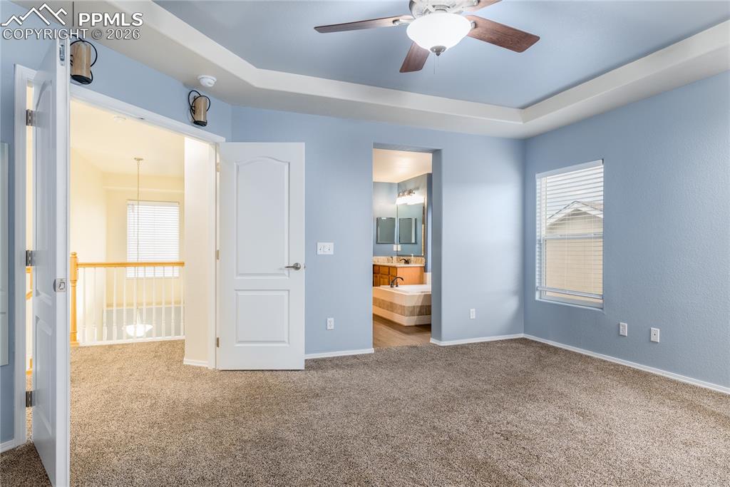 6432 Crystal Mountain Road Colorado Springs, CO 80923 - Photo 16 of 31 wooden floor in an empty room with a window