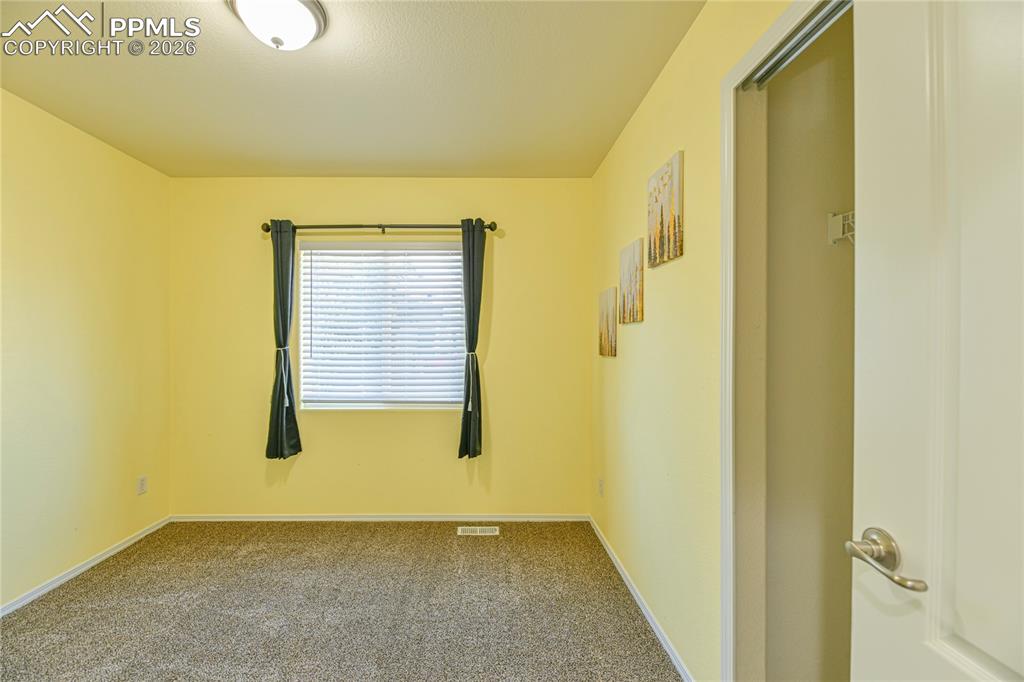 6432 Crystal Mountain Road Colorado Springs, CO 80923 - Photo 20 of 31 a view of an empty room with a window