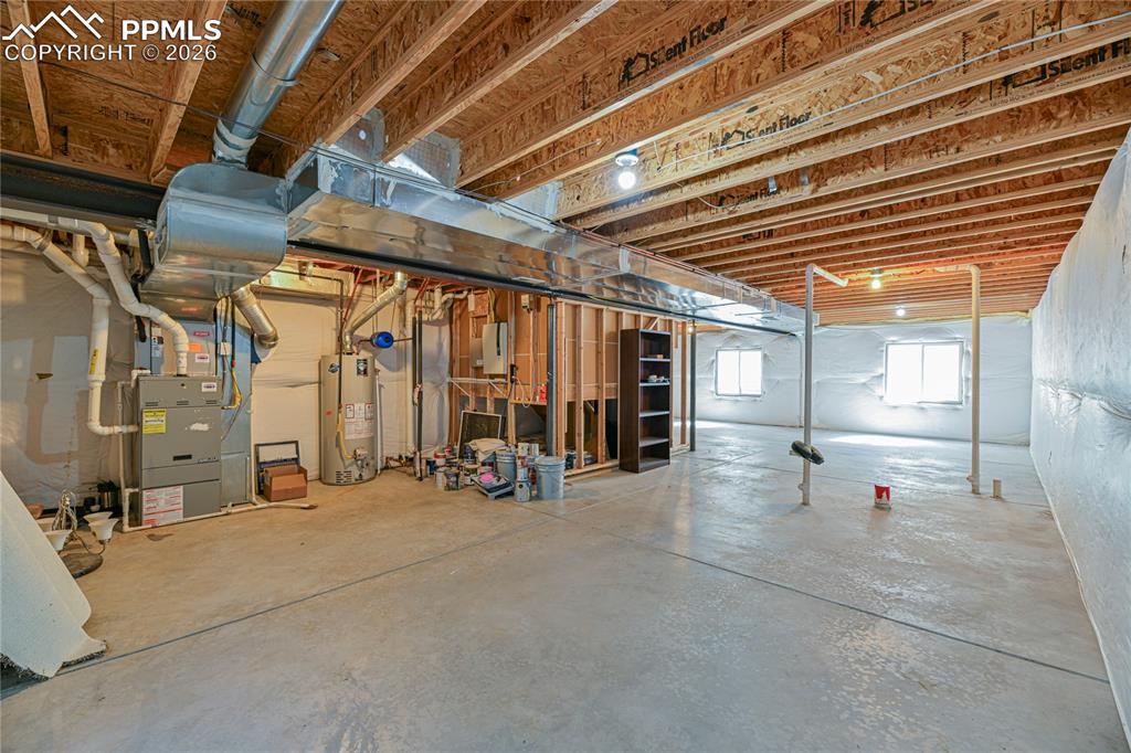 6432 Crystal Mountain Road Colorado Springs, CO 80923 - Photo 28 of 31 a view of a room with gym equipment