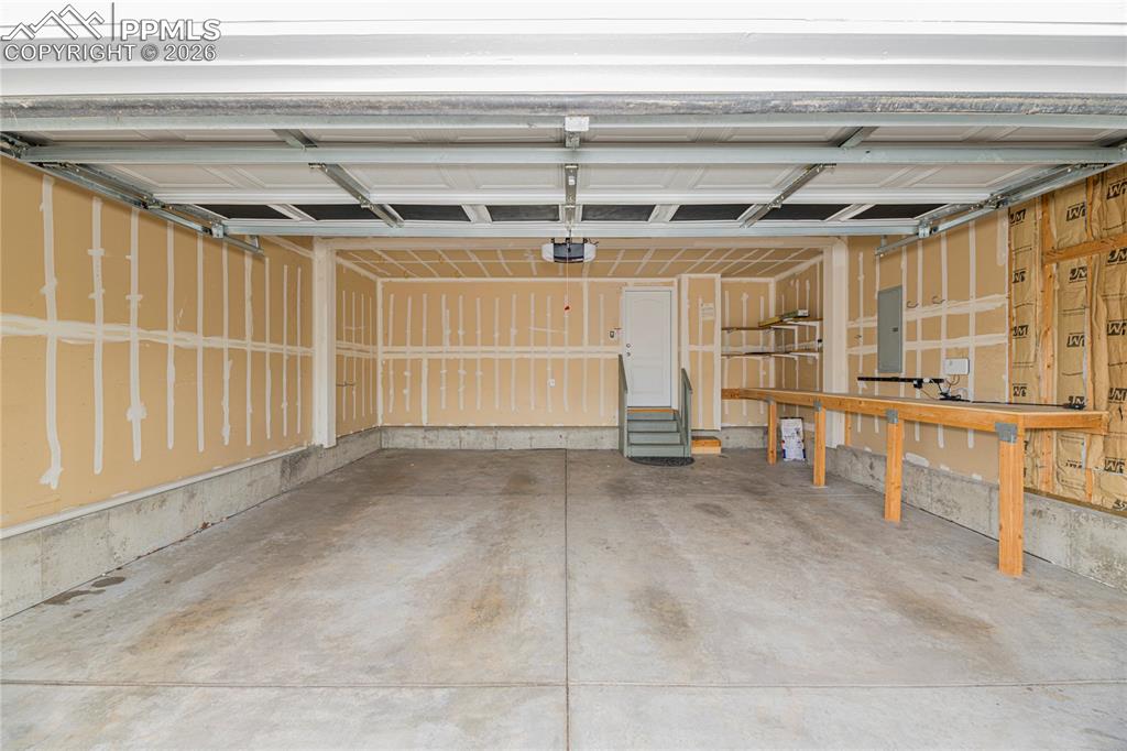 6432 Crystal Mountain Road Colorado Springs, CO 80923 - Photo 29 of 31 a view of a room with wooden walls
