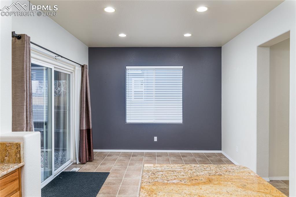 6432 Crystal Mountain Road Colorado Springs, CO 80923 - Photo 6 of 31 a view of an empty room with a window