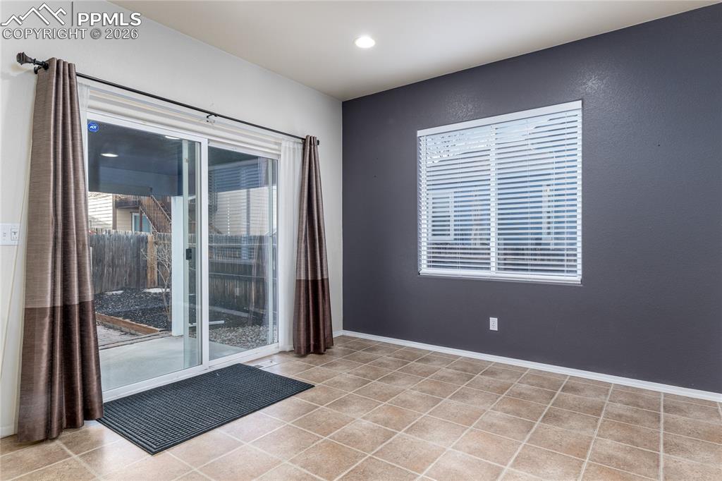 6432 Crystal Mountain Road Colorado Springs, CO 80923 - Photo 7 of 31 a view of an empty room with glass door