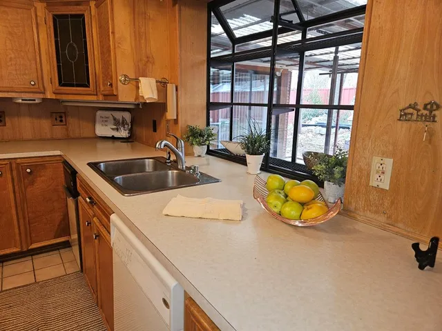 a kitchen with a sink and cabinets