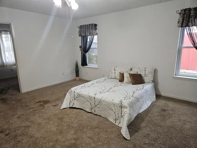 a bathroom with a shower and a sink