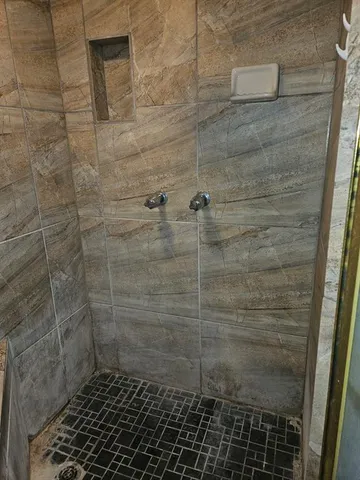 a view of an empty room with stairs