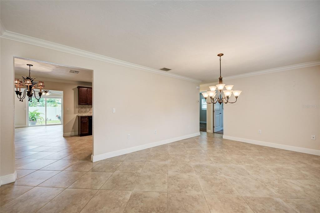 1330 Georgetowne Circle Sarasota, FL 34232 - Photo 6 of 46 a view of an empty room with a chandelier