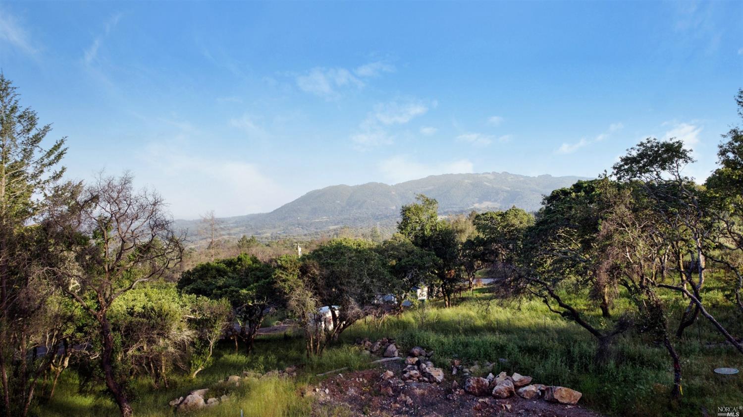 2728 Rollo Road Santa Rosa, CA 95404 - Photo 1 of 1 a view of a lake with mountains in the background