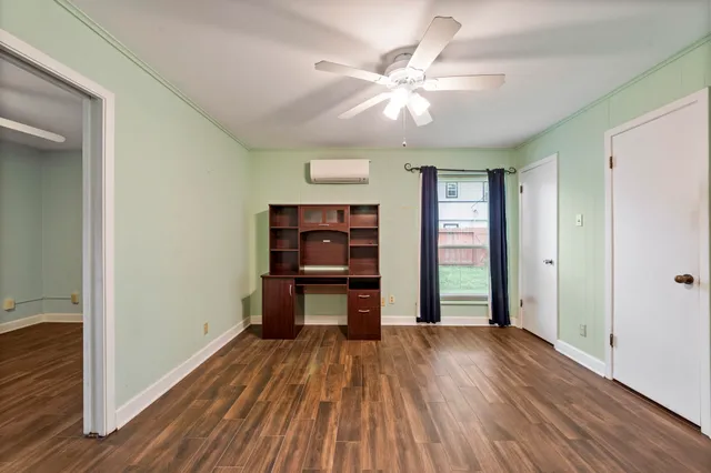 wooden floor in an empty room with a window