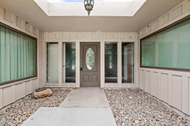 a view of a entryway door front of a house