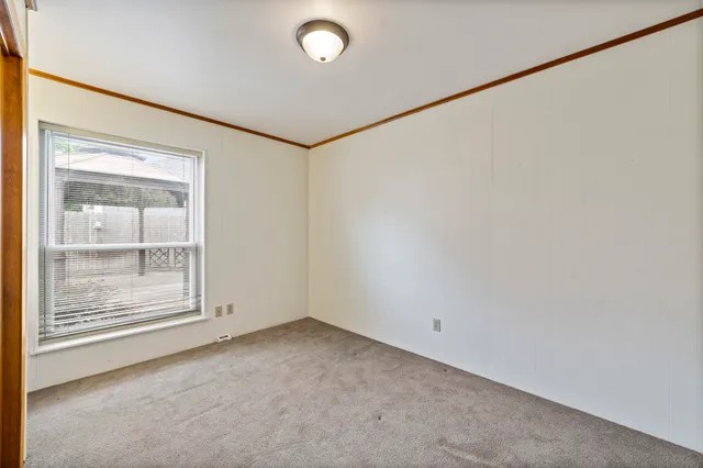 a view of a bathroom with a tub and shower