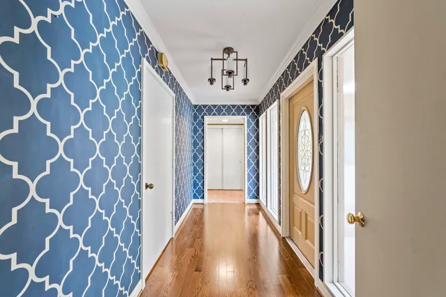 a view of a hallway with a front door