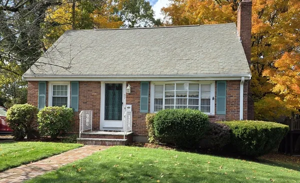 front view of a house with a yard