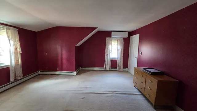 a view of hall way with furniture and entryway