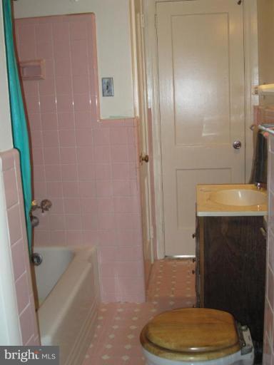 2719 Terrapin Road Silver Spring, MD 20906 - Photo 3 of 7 a bathroom with a sink a toilet and shower
