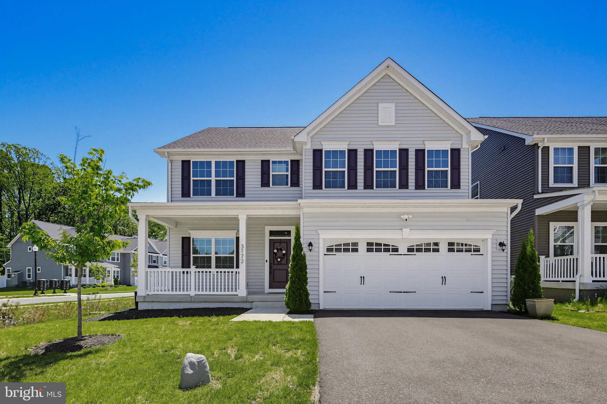 3172 Dodder Way Odenton, MD 21113 - Photo 1 of 59 a front view of a house with a yard and garage