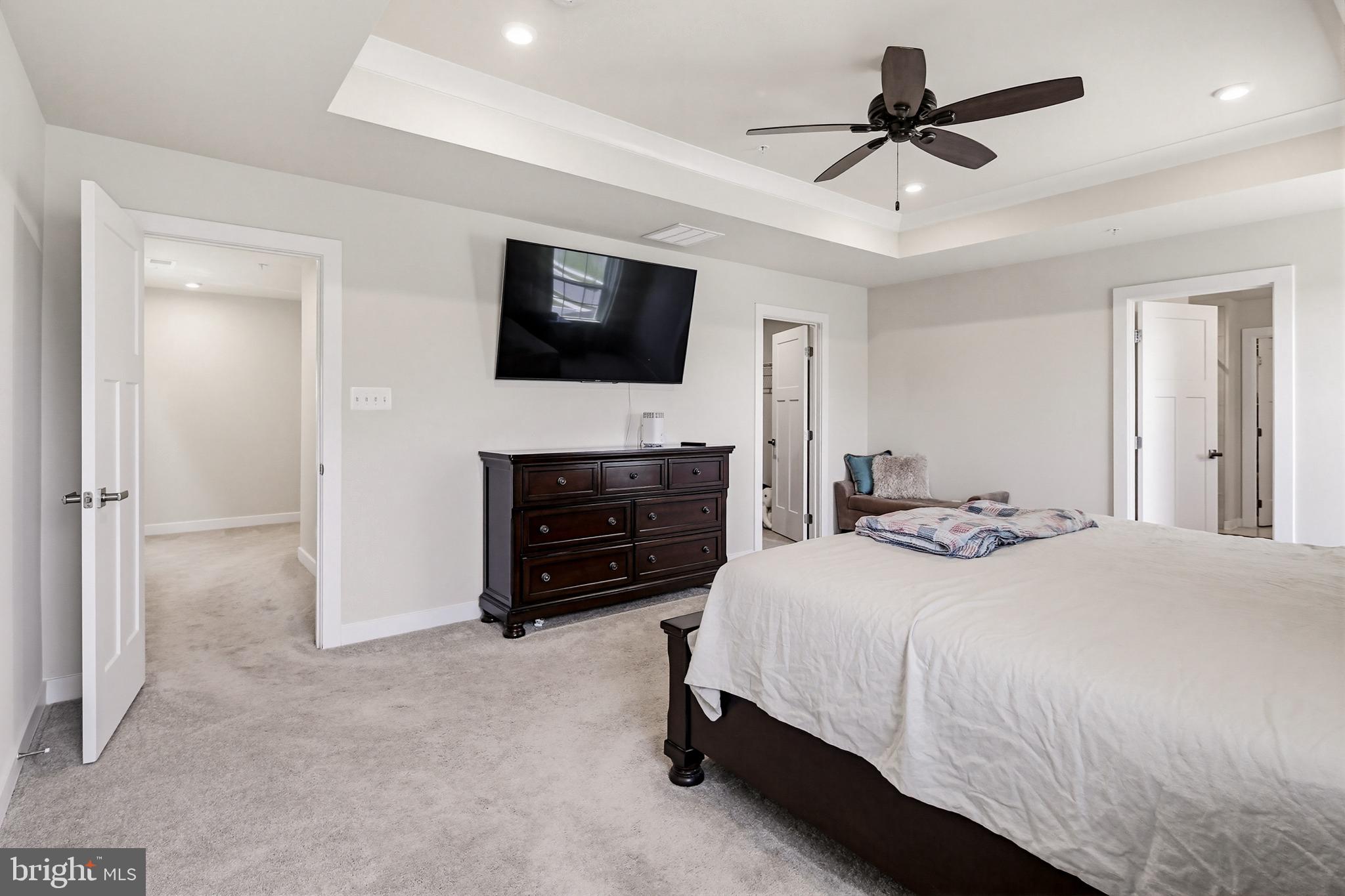 3172 Dodder Way Odenton, MD 21113 - Photo 24 of 59 a bedroom with a bed and a flat screen tv