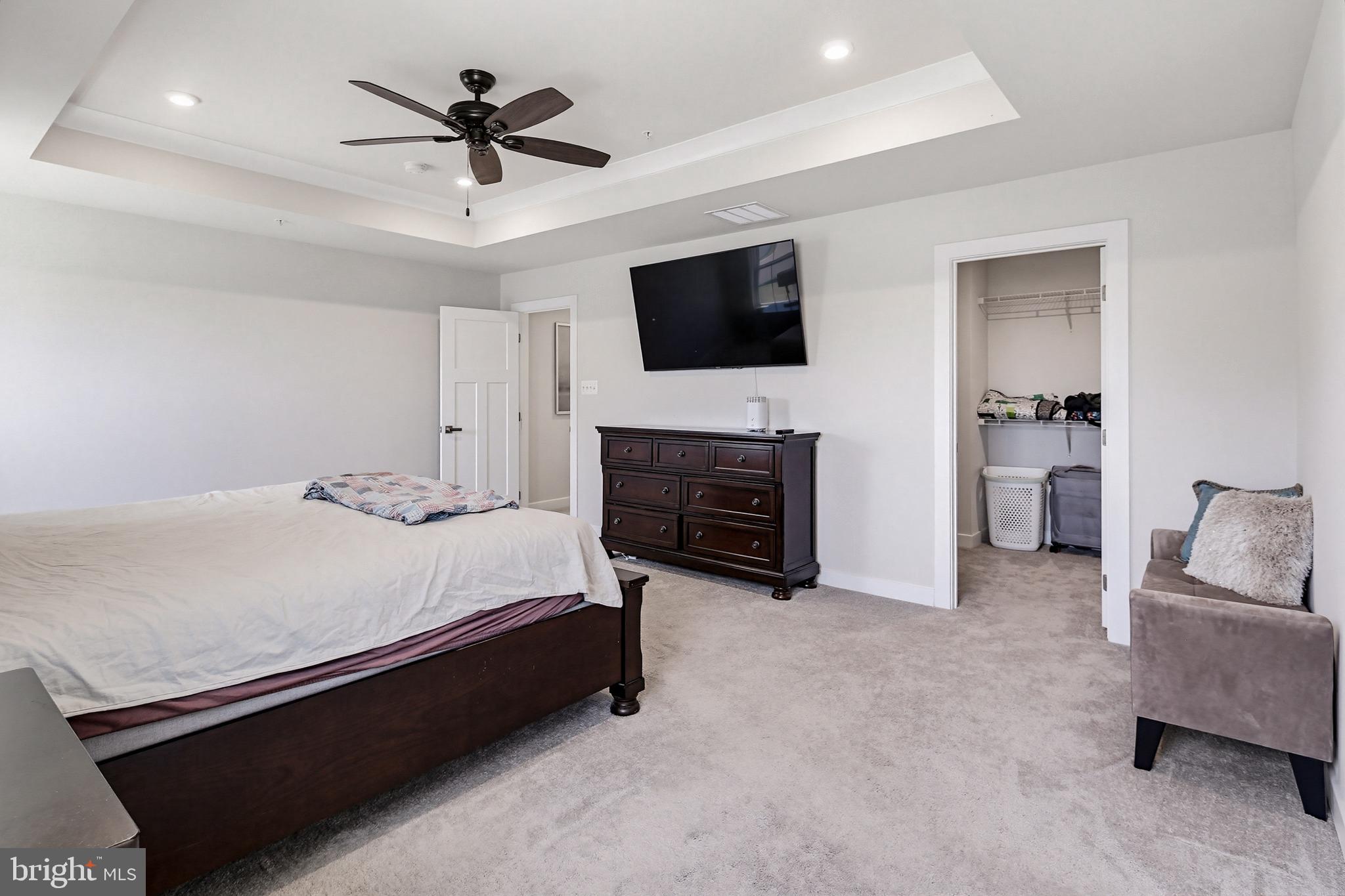 3172 Dodder Way Odenton, MD 21113 - Photo 25 of 59 a spacious bedroom with a bed and a flat screen tv