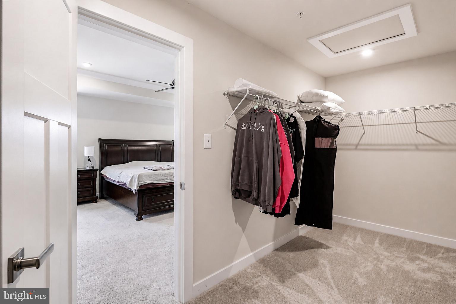 3172 Dodder Way Odenton, MD 21113 - Photo 26 of 59 a walk in closet with clothes and shoes