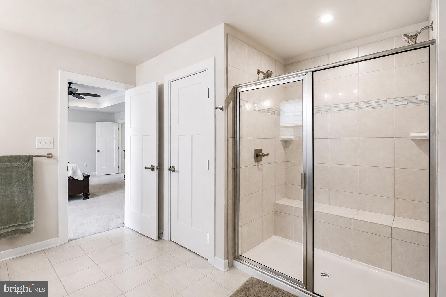 3172 Dodder Way Odenton, MD 21113 - Photo 28 of 59 a bathroom with a glass shower door and a glass door