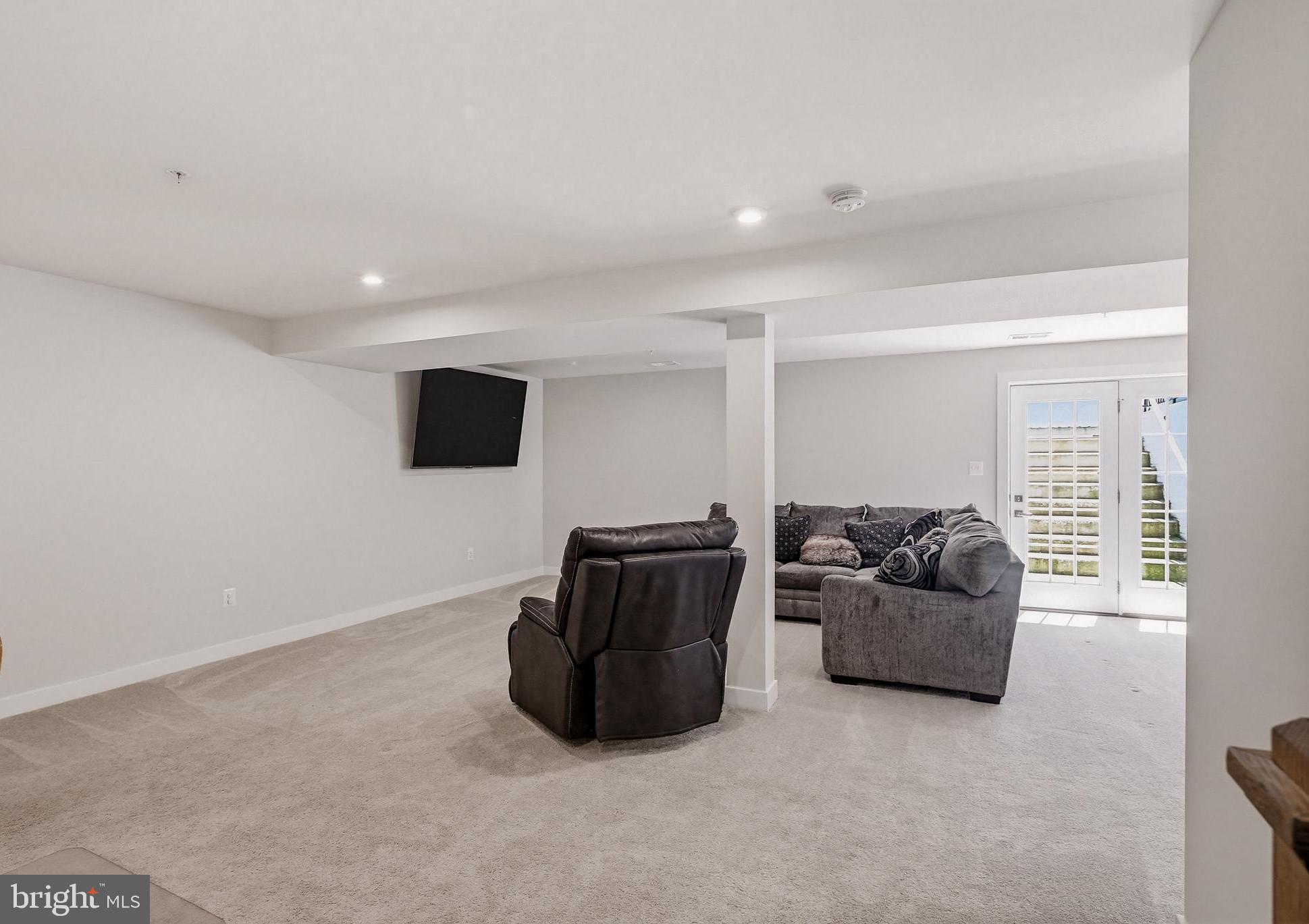 3172 Dodder Way Odenton, MD 21113 - Photo 38 of 59 a living room with furniture and a flat screen tv