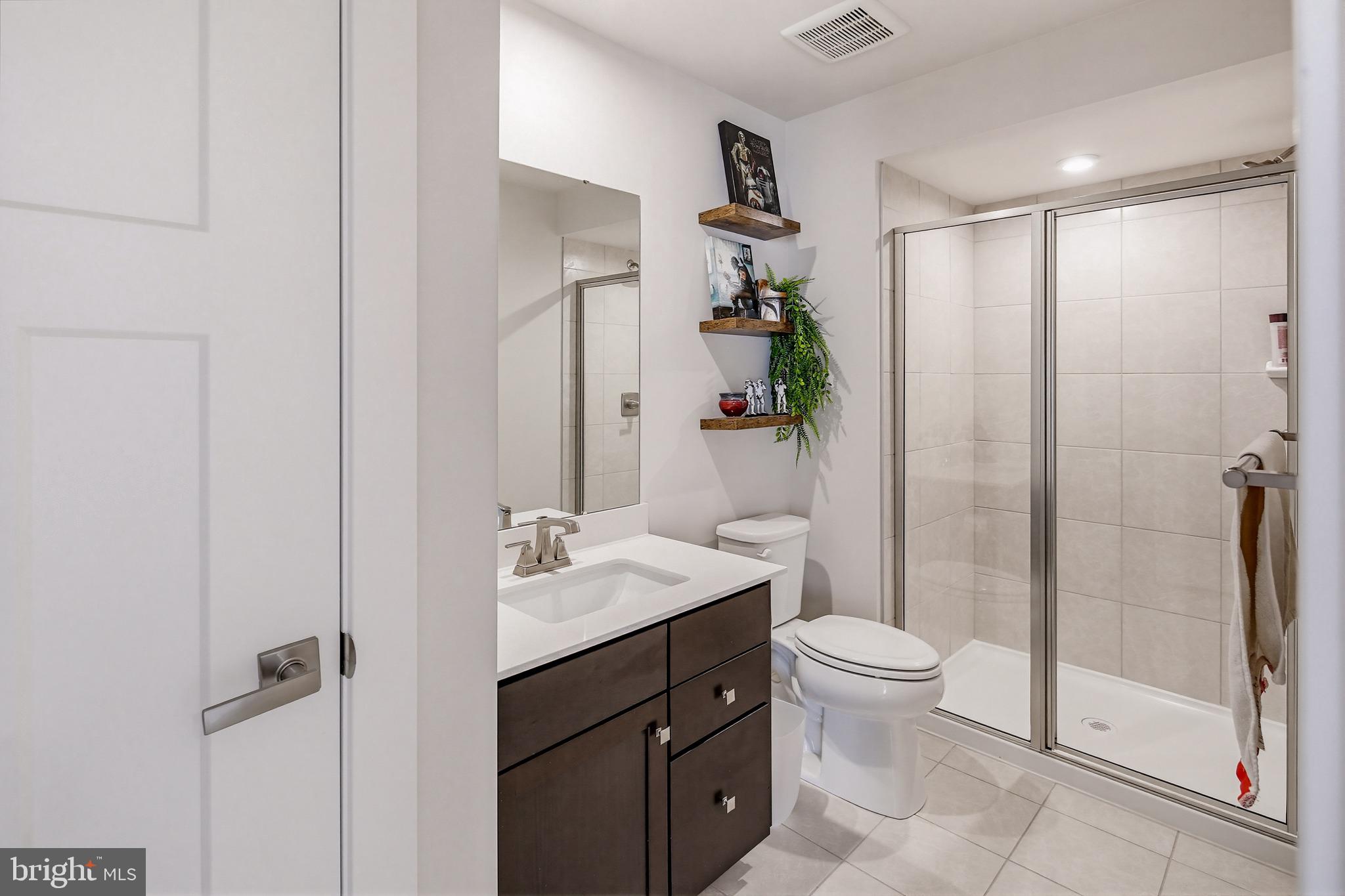 3172 Dodder Way Odenton, MD 21113 - Photo 44 of 59 a bathroom with a sink a toilet and shower