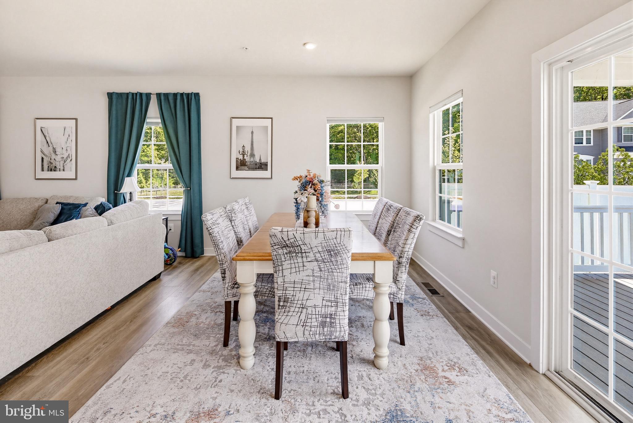 3172 Dodder Way Odenton, MD 21113 - Photo 10 of 59 a dining room with furniture a rug and a large window