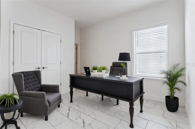 a view of a workspace with furniture