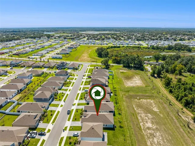 a view of swimming pool with a lot of trees in the background