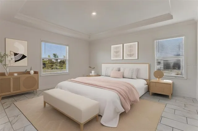 a spacious bedroom with a bed and couch