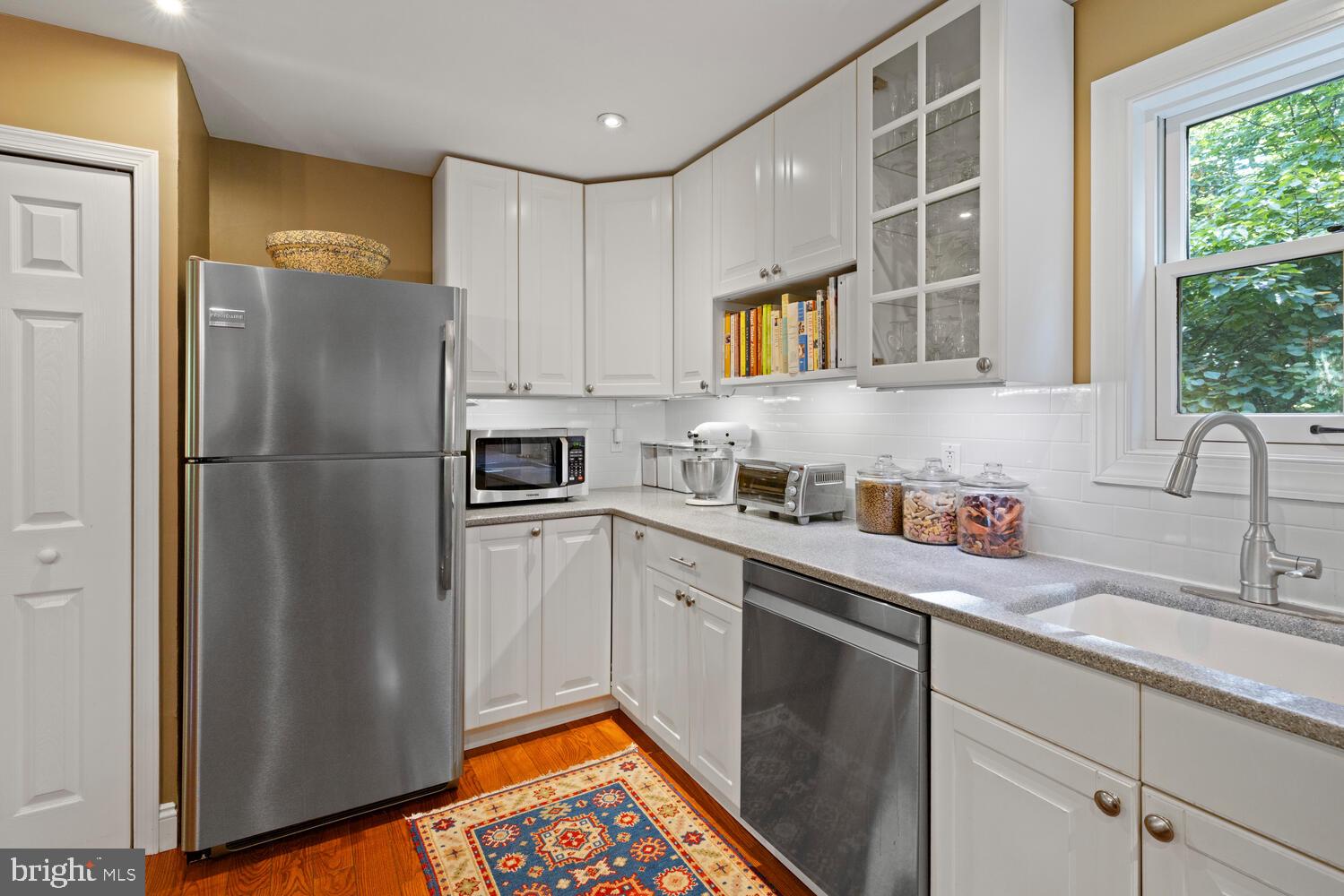 7 Walt Lane Wyncote, PA 19095 - Photo 13 of 44 a kitchen with stainless steel appliances a refrigerator sink and cabinets