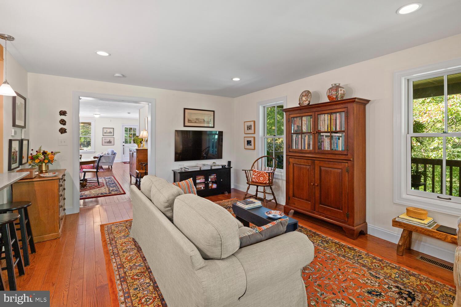 7 Walt Lane Wyncote, PA 19095 - Photo 10 of 44 a living room with furniture fireplace and a flat screen tv