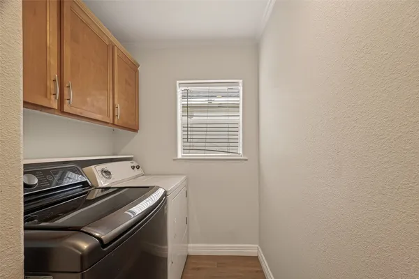 a view of a kitchen with wooden floor