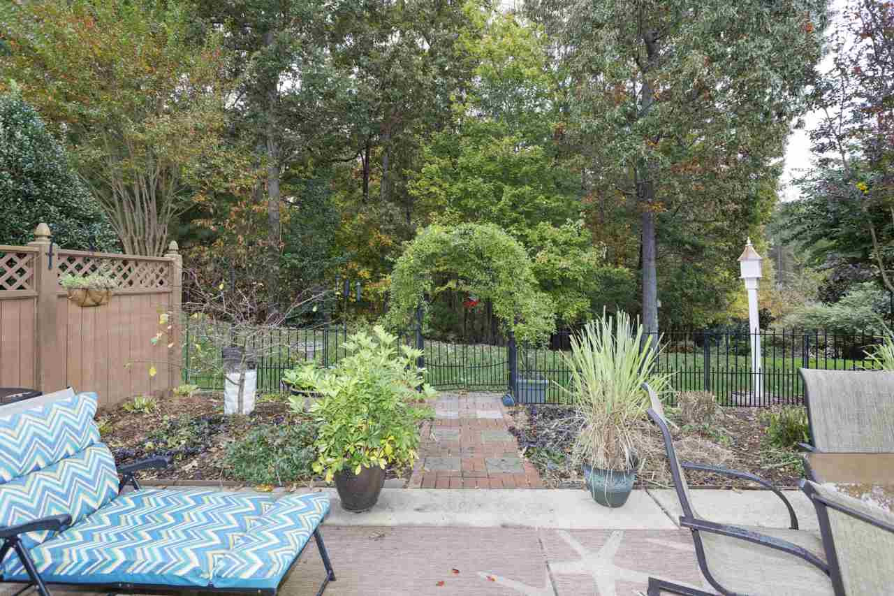 3743 Old Post Road Raleigh, NC 27612 - Photo 23 of 25 This wooded, private view is HARD to find in townhome living! Come commune with the birds, bees and deer! Patio/Deck