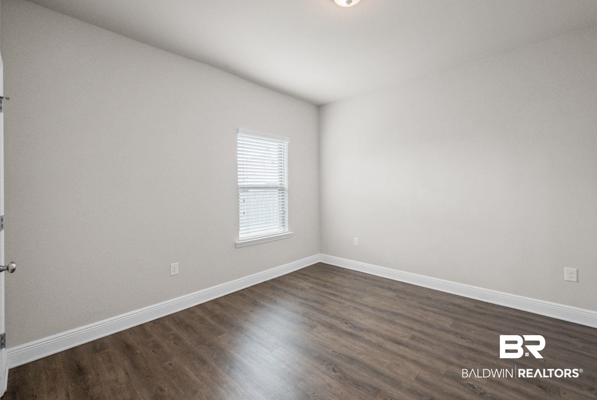2074 Bourbon Street Foley, AL 36535 - Photo 38 of 46 Unfurnished room featuring dark hardwood / wood-style floors
