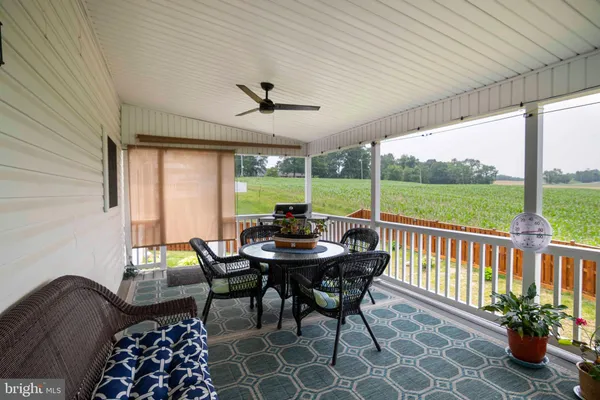 a view of a patio with a table chairs and a table