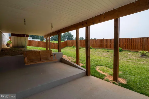 a view of the empty room with wooden floor